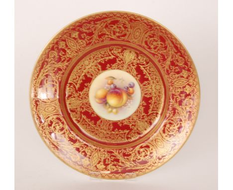 A Royal Worcester cabinet plate decorated by Telford with a hand painted roundel of peaches and cherries, the border edge in 