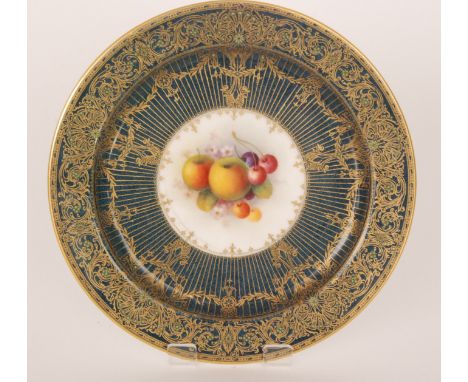 A Royal Worcester fruit painted cabinet plate decorated by Shuck with hand painted peaches and grapes, the border edge in blu