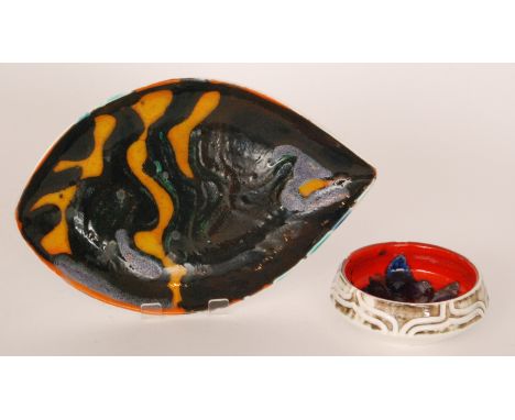 A Poole Pottery Delphis shape 86 bowl, the interior decorated in the typical manner with an abstract motif against a red grou