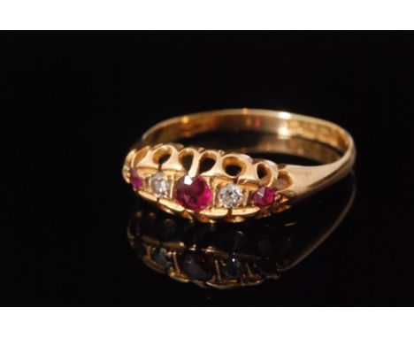 A 1930s hallmarked 18ct five stone ruby and diamond boat head ring, graduated stones to pierced head and plain ridged band, w