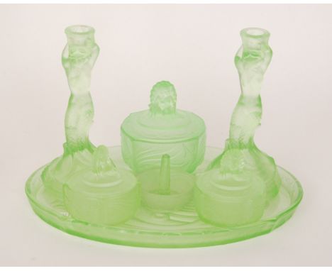 A 1930s Art Deco Walther & Sohne Nymphen (or Mermaids) seven piece green pressed glass dressing table set comprising three tr