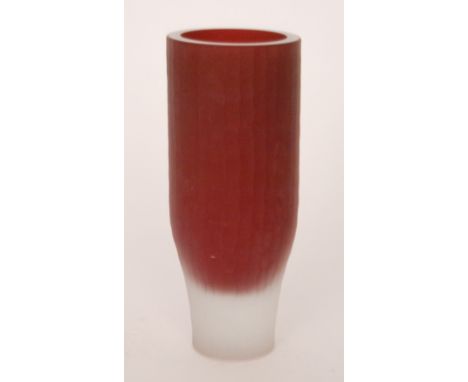 A contemporary studio glass vase with a ruby core with a clear frosted exterior with a planish effect, indistinctly signed, h