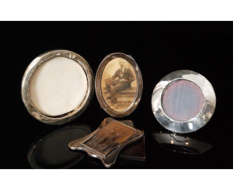 Three early 20th Century hallmarked silver easel photograph frames of plain form, together with a similar unmarked example, S