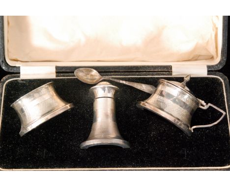 A cased hallmarked silver Art Deco three piece cruet set detailed with part engine turned decoration, height, 17cm, Birmingha