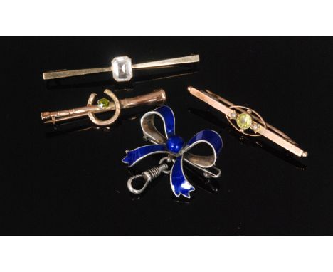 Three early 20th Century 9ct stone set bar brooches, together with a silver and blue enamel bow brooch, S/D. (4) 