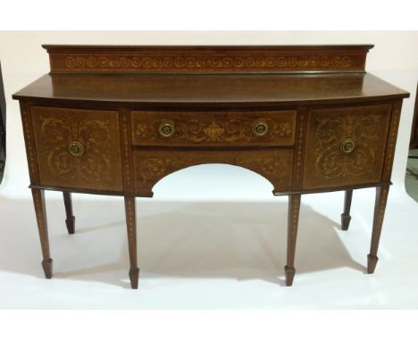 A Georgian style mahogany bow-fronted sideboard with foliate style inlay, raised to square tapered legs with spade feet, heig