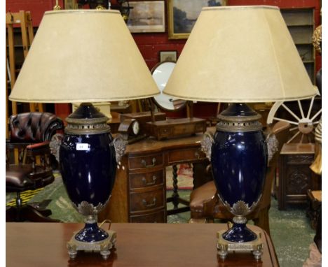 An impressive pair of bronze mounted deep blue glazed ceramic lamps (2)
