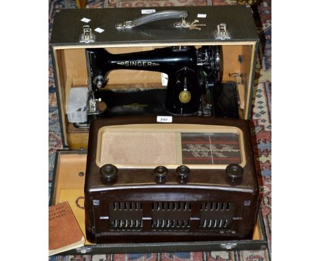 A vintage Cossor Melody Maker valve radio, brown and cream case;  an electrical singer sewing machine, cased (2)