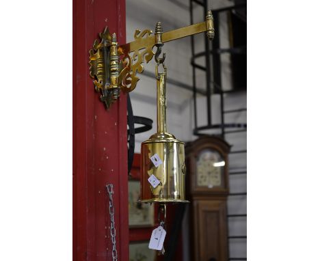 A G. Salter brass bottle jack with brass wall bracket and key