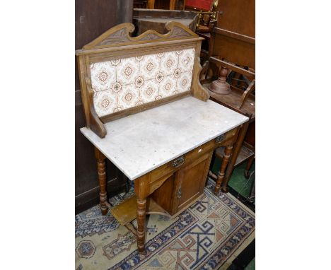 A late Victorian tile back washstand.