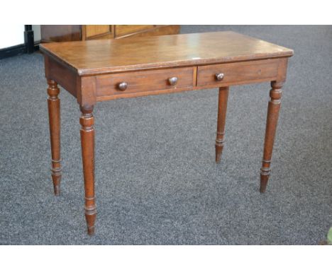 A Victorian oak hall table, oversailing top, two short drawers to frieze, button handles, turned tapering legs, circa 1880. 7