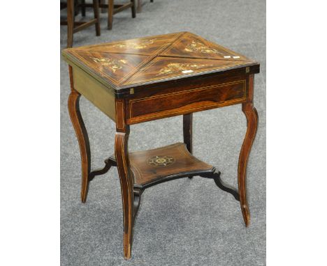 A late Victorian rosewood envelope card table, inlaid with swags and flora, green baize playing area, counter cups, cabriole 