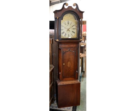 An oak longcase clock, broken swan neck pediment, arched dial, Roman numerals flanked by reeded columns, inlaid shaped door t