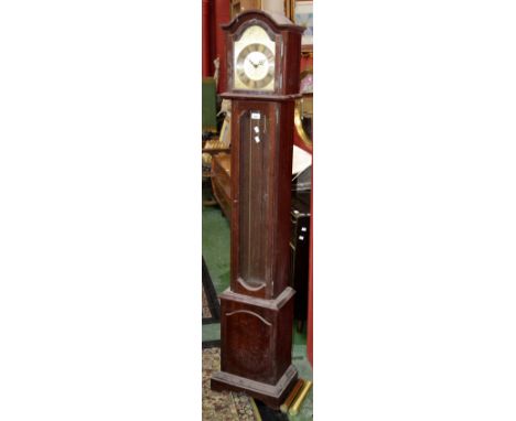 A modern grandmother clock, dome top, arched face, silvered chapter ring, Roman numerals, FHS movement, glass door to trunk, 