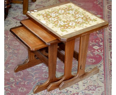 A G-Plan tile top teak nest of tables.