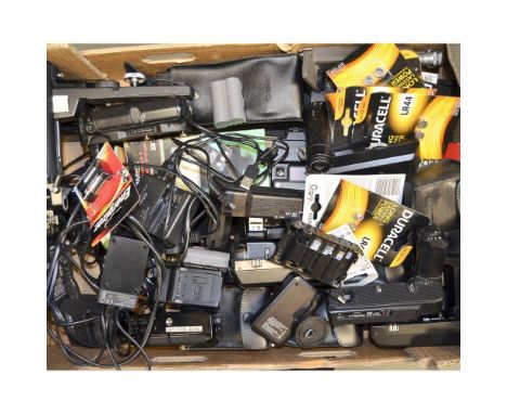 A Tray of Camera Accessories, including flash units, power winders, batteries and chargers.