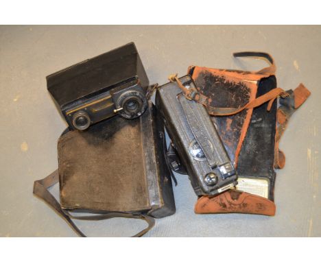 A Jemelle Camera, camera appears to have been modified/adapted with a block of wood and bush shutter one one lens, including 