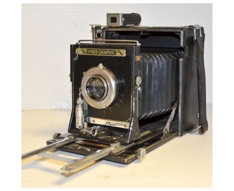 A Graflex Speed Graphic Press Camera,  serial no. 307048, body F-G, side handle, 5 x 7" plates, Kalart Sychronized Rangefinde