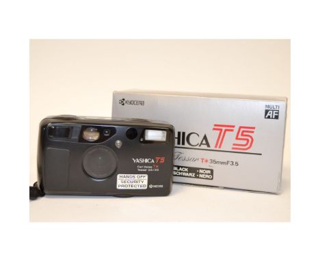 A Yashica T5 35mm Compact Camera, black, with a Carl Zeiss T* 35mm f/3.5 lens, in maker's box with original bill of sale