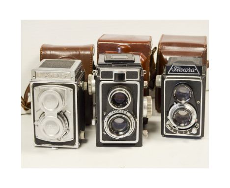 Three TLR Cameras, a Zeiss Ikon Ikoflex with a Novar-Anastigmat 75mm f/3.5 lens, a Firstflex with a First Anastigmat 8.0cm f/