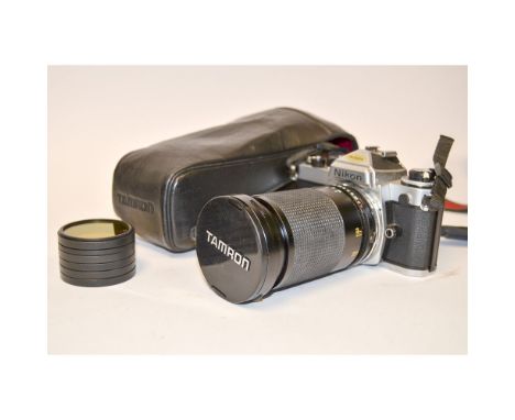 A Nikon FE SLR Camera, chrome, no. 4453796, shutter working, body, G, with a Tamron 35-135mm f/3.5-4.2 zoom lens, in leather 