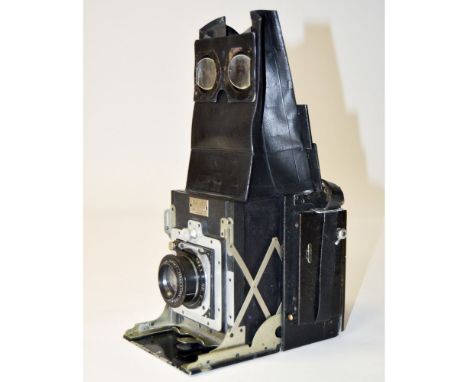 A Newman & Guardia Folding Reflex Camera, 1921-1930'3 with Ross Xpress 135mm f/4.5 lens, shutter not firing, paint mark to mi