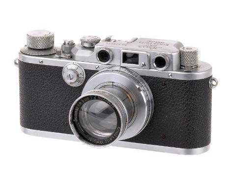 A Leica IIIb Rangefinder Camera, 1939, chrome, serial no. 326412, with Leitz Summar f/2 50mm lens, 1938, chrome, serial no. 4