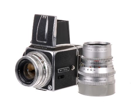 A Hasselblad 500C Camera, chrome, serial no. CE38787, with Carl Zeiss Planar f/2.8 80mm lens, chrome, serial no. 2663702, bod