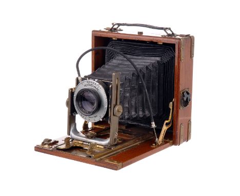 An Unmarked Tropical Mahogany Camera, possibly German, 4½”x3½”, brass bound corners, with Kodak Ektar f/7.7 203mm lens, body,