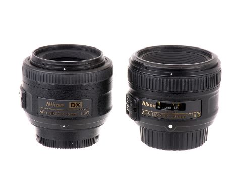 A Nikon Nikkor AF-S G DX f/1.8 35mm Lens, black, serial no. 2381069, body, VG, elements, VG, some very light internal haze, t