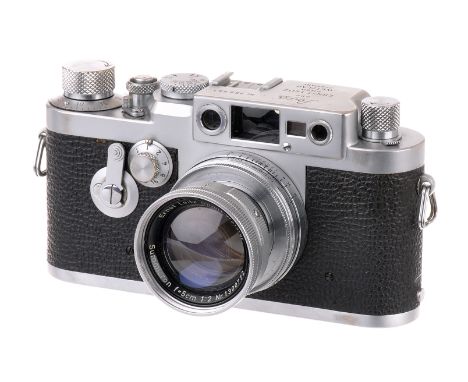 A Leica IIIg Rangefinder Camera, 1959, chrome, serial no. 969451, with Leitz Summicron f/2 50mm lens, 1955, chrome, serial no