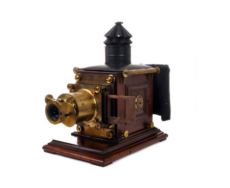 A Watson & Sons Magic Lantern, circa 1900, mahogany body with brass fittings, converted to electric illuminant, with double-e