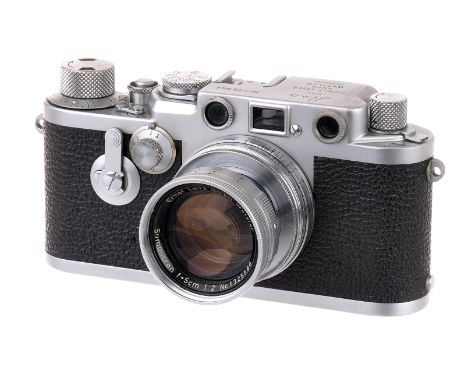 A Leica IIIf Red Dial Delay Rangefinder Camera, 1955, chrome, serial no. 795044, with Leitz Summicron f/2 50mm lens, 1955, ch