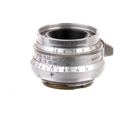 A Leitz Summaron f/2.8 35mm Lens, 1959, chrome, serial no. 1667434, body, G, elements, VG, some light internal haze