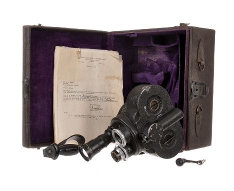 A Bell & Howell Eyemo 35mm Cine Camera, serial no. 157390, with Bausch & Lomb Baltar f/2.3 25mm lens, chrome, serial no. UF53