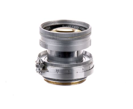 A Leitz Summicron f/2 50mm Lens, 1952, early numbered radioactive, chrome, serial no. 1041247, body, VG, elements, G, some in