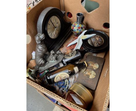A box of collectables to include ebonised wood mantel clock, spelter figure of dogs, antique ceramic wall plate, 1937 Coronat