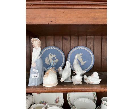 Eight pieces of Lladro &amp; Nao together with two Wedgwood plates.  