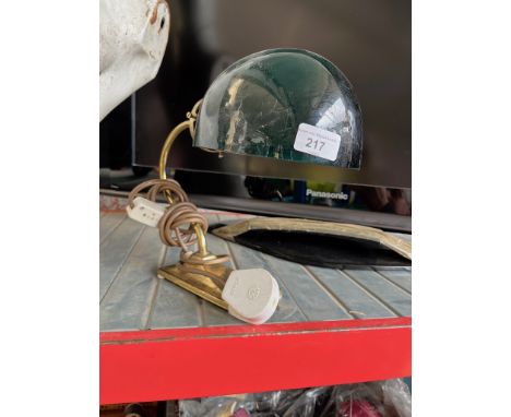 A brass and green glass table lamp.  