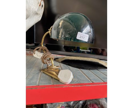 A brass and green glass table lamp.  