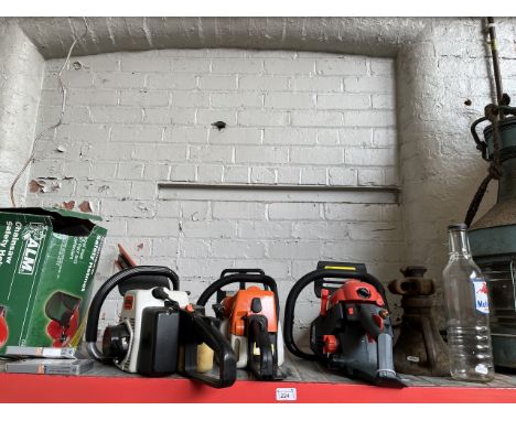 Two petrol chainsaws, a petrol hedge trimmer, safety helmet, 2 spare chains for chainsaw, an old cast iron jack and a Mobiloi