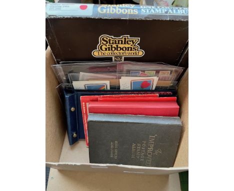 A box containing various UK and world stamps, first day covers, stamps albums, Stanley Gibbons collectors books etc.  