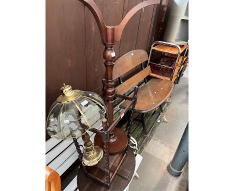 An oak twisted leg table, a mahogany plant stand and a brass table lamp.  