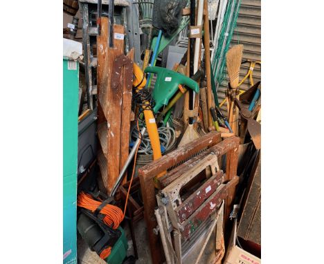 A quantity of garden tools including strimmer, lawn rake, hose pipe, galvanised bin, wooden step ladders, 2 trestles, 2 foldi