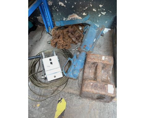 A towbar, chain and pulley, 56 pound weight and a trailer winch.  