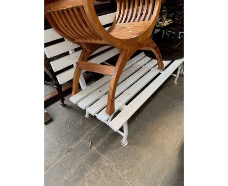 A white painted garden bench.  