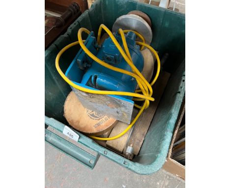 A motor of some description - might be used part of a lathe or grinder and a box and a toolbox of tools, etc.