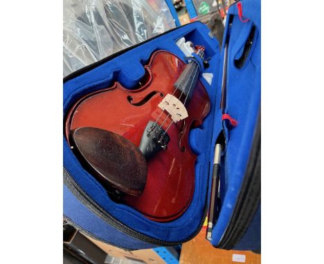 A Stentor Student I violin in case with bow and instructions manual.  