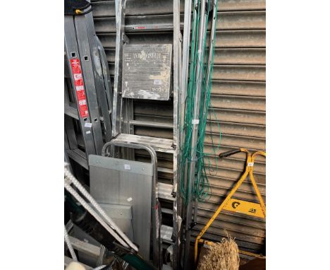 A folding aluminium extension ladder, 2 aluminium stepladders, 2 platforms, and a rotary washing line  