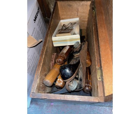 A wooden box of tools to include Marshall chisels, planes, metric weights, etc.  